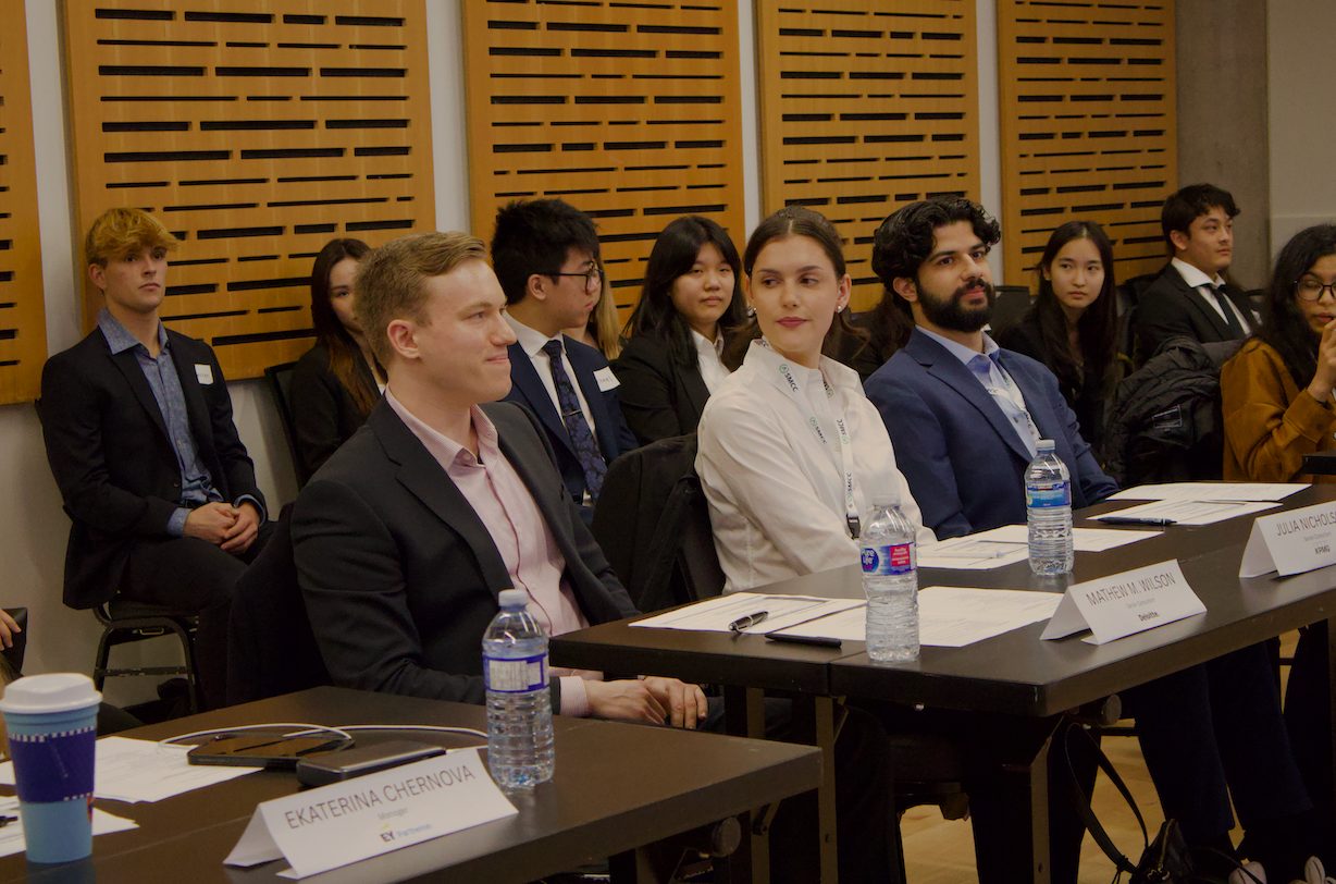 Students and judges seated at an SMCC case competition.