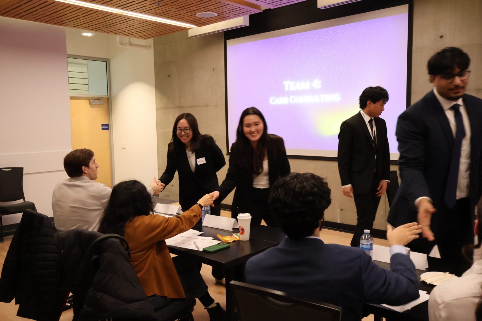 Students talking with industry professionals at an SMCC networking evening.