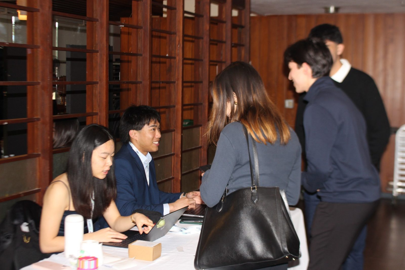An SMCC team presenting their case to a room at a club event.